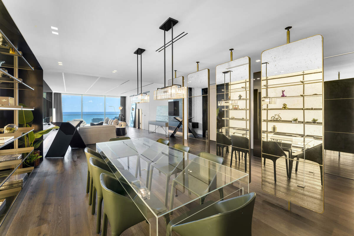 A dining area in the condo features rotating mirrored panels.